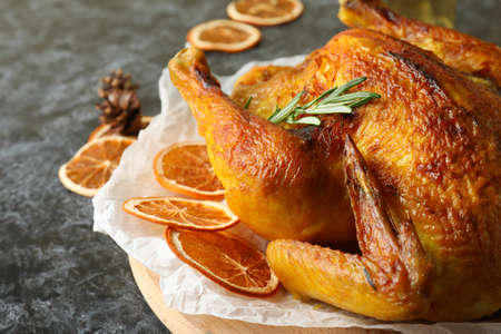 Concept of Christmas roast turkey on black smokey backgroundの写真素材