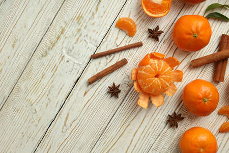 Mandarins and cinnamon on white wooden backgroundの写真素材