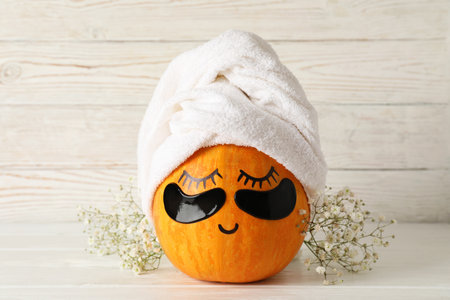 Spa concept with pumpkin on white wooden tableの写真素材