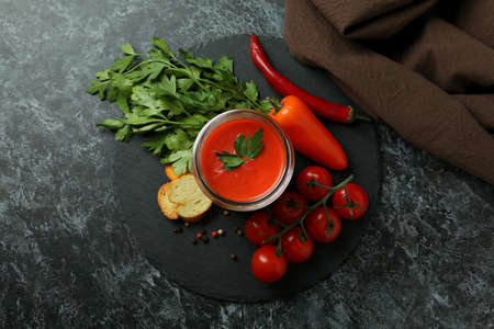 Concept of tasty eating with Gazpacho soup on black smokey backgroundの写真素材