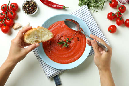Concept of tasty eating with Gazpacho soup on white backgroundの写真素材