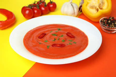 Gazpacho soup and ingredients on two tone backgroundの写真素材