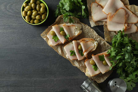 Delicious bruschetta snacks on dark wooden background