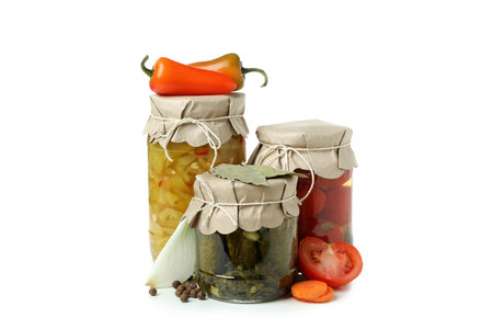 Jars of pickled vegetables isolated on white backgroundの写真素材