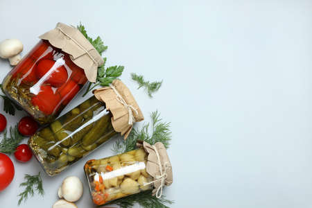 Jars of pickled vegetables on light gray backgroundの写真素材
