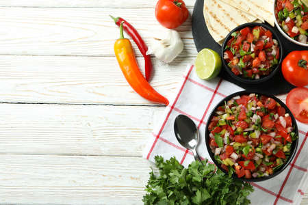 Mexican food concept with Pico de Gallo on white wooden tableの写真素材