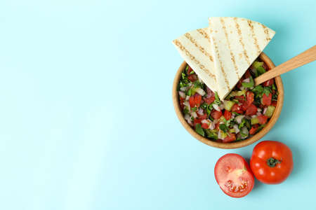Mexican food concept with Pico de Gallo on blue background