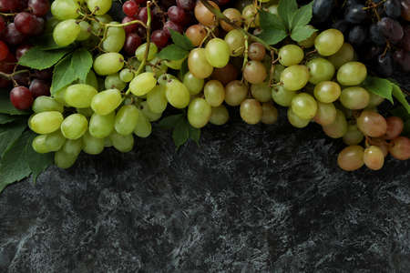 Various ripe grape on black smokey backgroundの写真素材