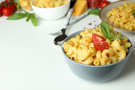 Concept of tasty eating with macaroni with cheese on white backgroundの写真素材