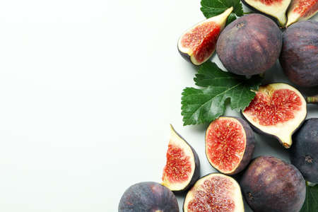 Fig with leaves on white background, space for textの写真素材