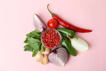Different spicy vegetables on pink background, top viewの写真素材