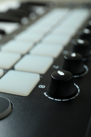 Midi keyboard all over background, close up