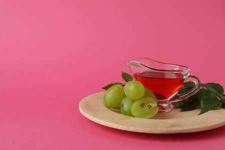 Concept of grape vinegar on pink backgroundの写真素材