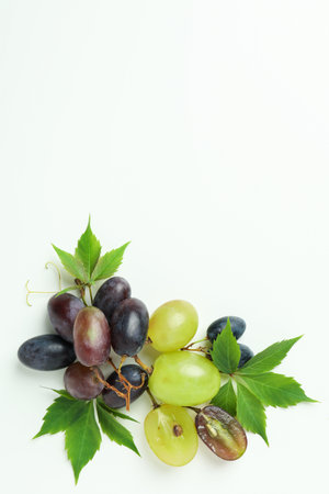 Ripe grape with leaves on white backgroundの写真素材