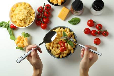 Concept of tasty eating with macaroni with cheese on white background