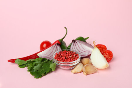 Different spicy vegetables on pink background, close upの写真素材