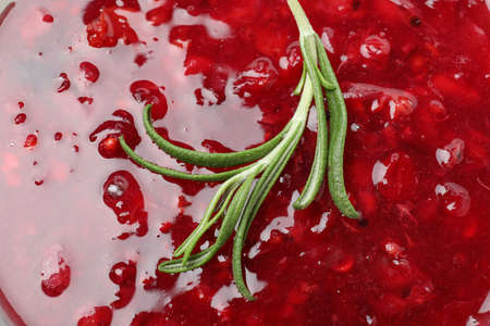 Cranberry sauce with rosemary all over backgroundの写真素材