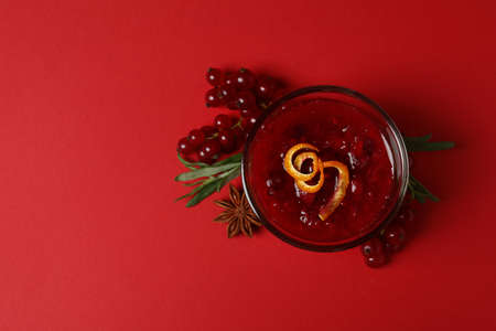 Cranberry sauce and ingredients on red backgroundの写真素材