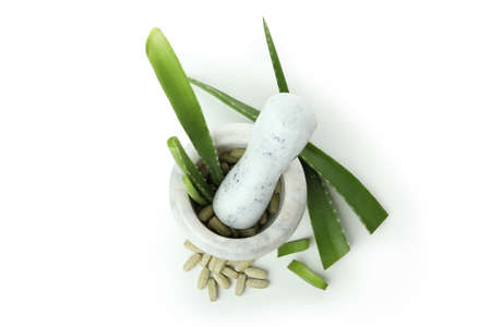 Concept of herb pills with aloe isolated on white backgroundの写真素材