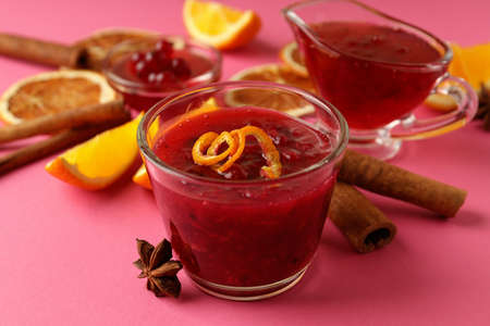 Cranberry sauce and ingredients on pink backgroundの写真素材