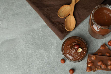 Concept of delicious food with chocolate paste on gray textured tableの写真素材