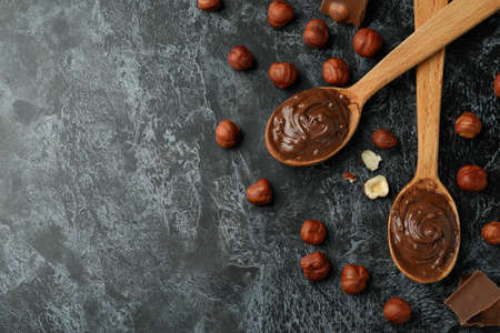 Concept of delicious food with chocolate paste on black smokey backgroundの写真素材