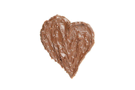 Chocolate paste in heart shape isolated on white backgroundの写真素材