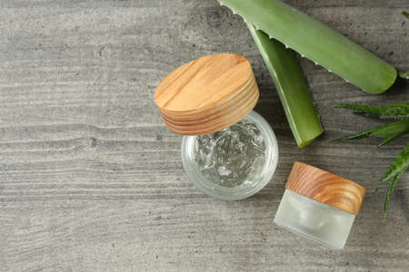 Aloe vera and gel on gray textured tableの写真素材