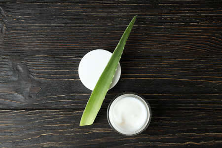 Aloe vera leaf and cream on wooden backgroundの写真素材