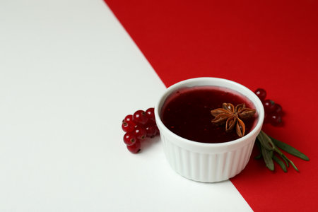 Cranberry sauce and ingredients on two tone backgroundの写真素材
