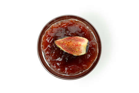 Bowl with fig jam and slice isolated on white backgroundの写真素材