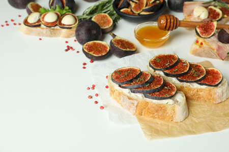 Concept of tasty food with bruschetta with fig on white backgroundの写真素材