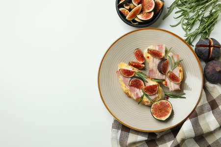Concept of tasty food with bruschetta with fig on white backgroundの写真素材