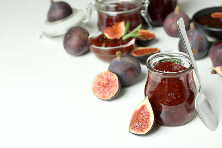 Concept of tasty food with fig jam on white backgroundの写真素材