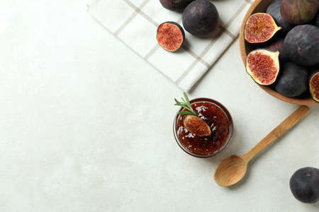 Concept of tasty food with fig jam on white textured backgroundの写真素材