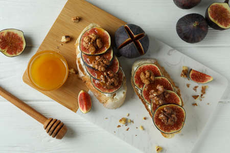 Concept of tasty food with bruschetta with fig on white wooden tableの写真素材