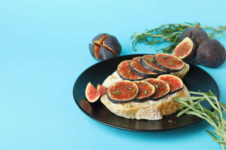 Plate with bruschetta with fig on blue backgroundの写真素材