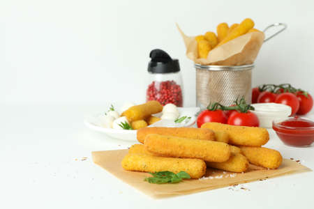Concept of tasty food with cheese sticks on white backgroundの写真素材