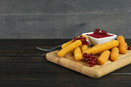 Concept of tasty food with cheese sticks on rustic wooden tableの写真素材