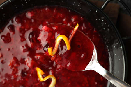 Dish and spoon with cranberry sauce, close upの写真素材