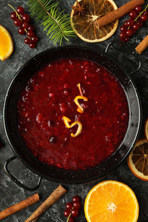 Cranberry sauce and ingredients on black smokey backgroundの写真素材