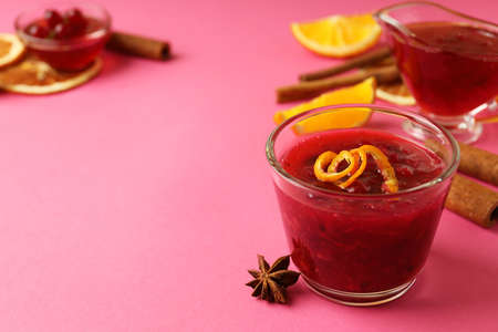 Cranberry sauce and ingredients on pink backgroundの写真素材