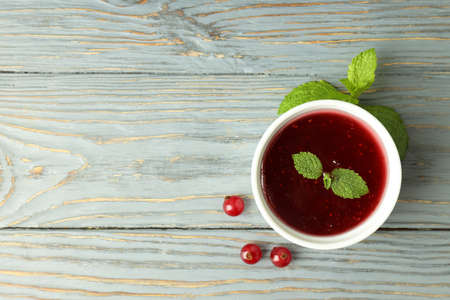 Bowl of cranberry sauce on gray wooden backgroundの写真素材