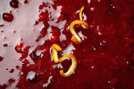 Cranberry sauce with orange peels all over backgroundの写真素材