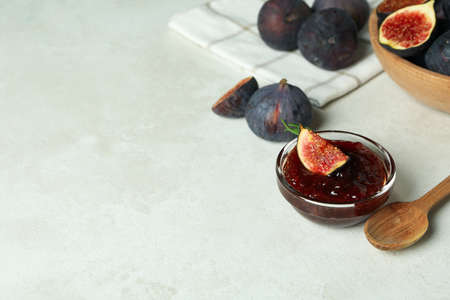 Concept of tasty food with fig jam on white textured backgroundの写真素材