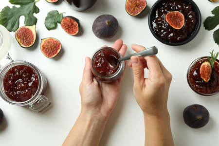 Concept of tasty food with fig jam on white backgroundの写真素材