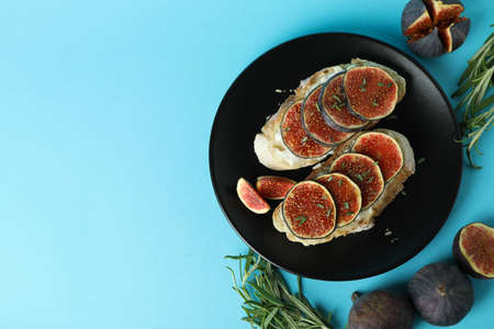 Plate with bruschetta with fig on blue backgroundの写真素材