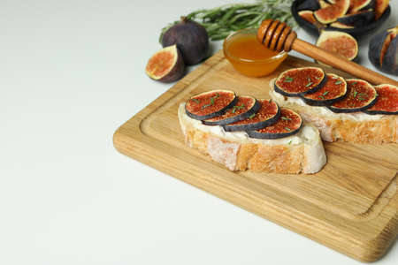 Concept of tasty food with bruschetta with fig on white backgroundの写真素材