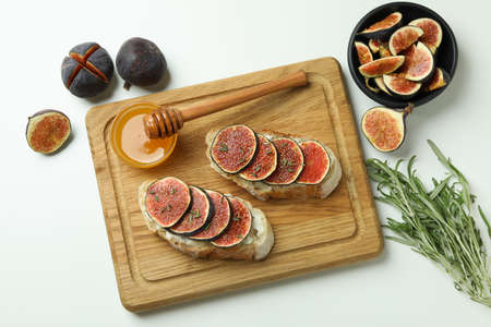 Concept of tasty food with bruschetta with fig on white backgroundの写真素材