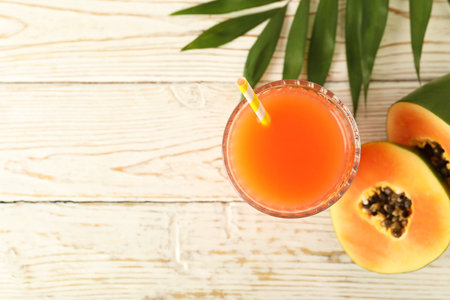 Fresh papaya juice on white wooden tableの写真素材